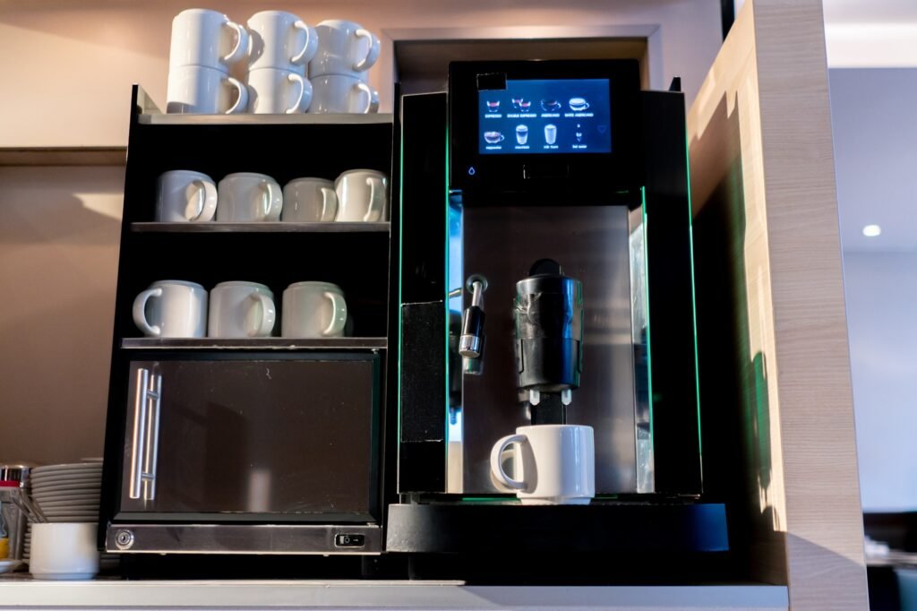 close-up of the process of making fragrant coffee with an automatic coffee machine in a hotel